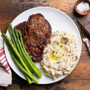 Steak de carne com pure de inhame e aspargos